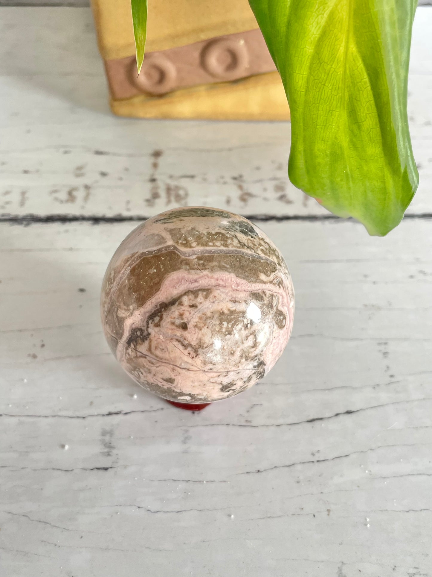 Rhodochrosite Sphere Includes Holder