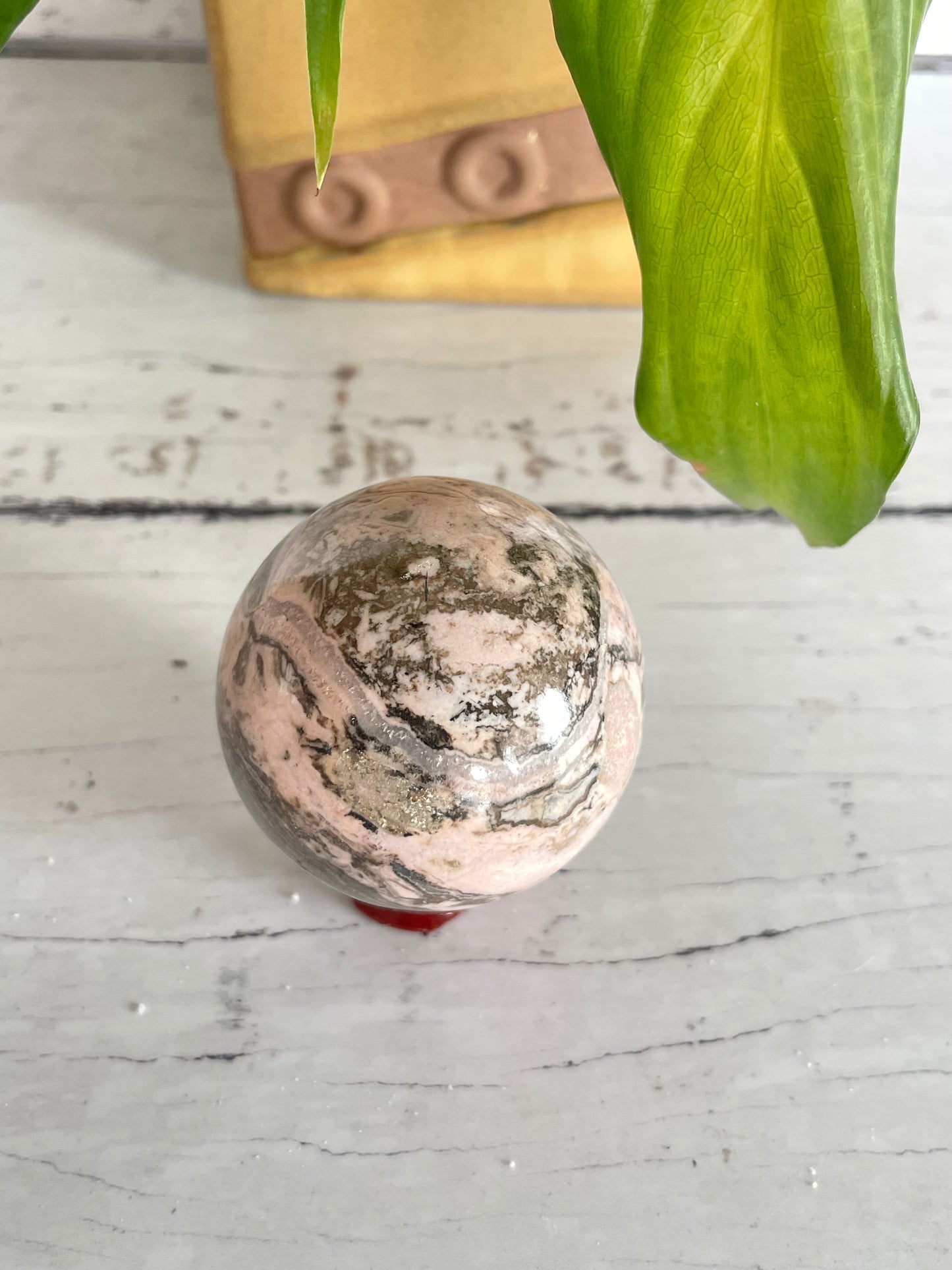 Rhodochrosite Sphere Includes Holder