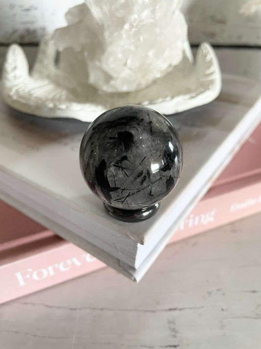 Tourmaline In Quartz Sphere Includes Holder