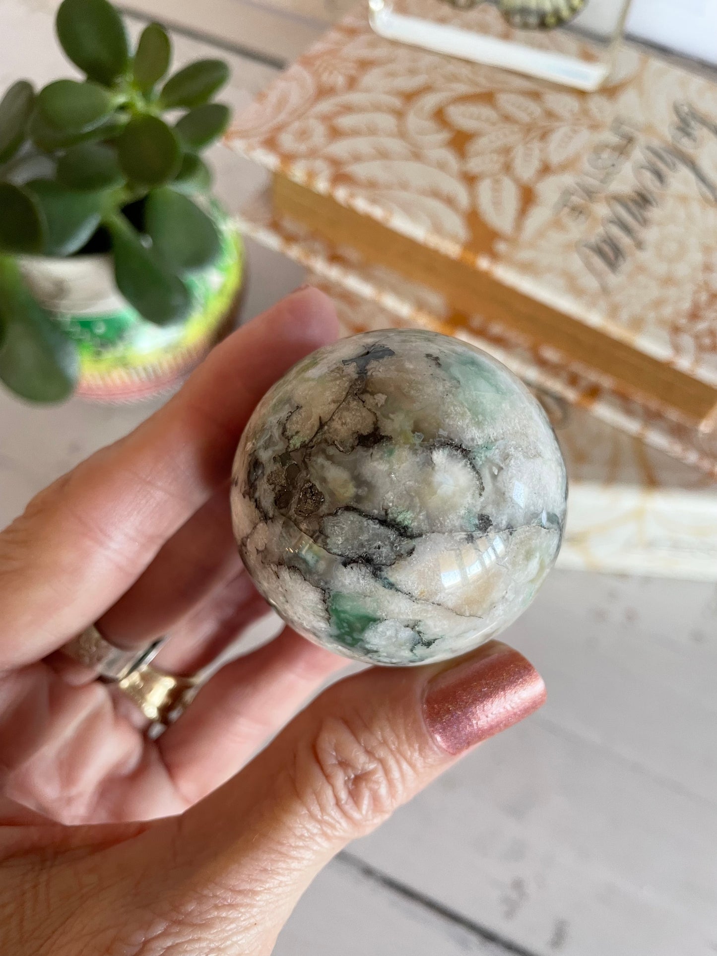 Green Flower Agate Sphere includes wooden holder