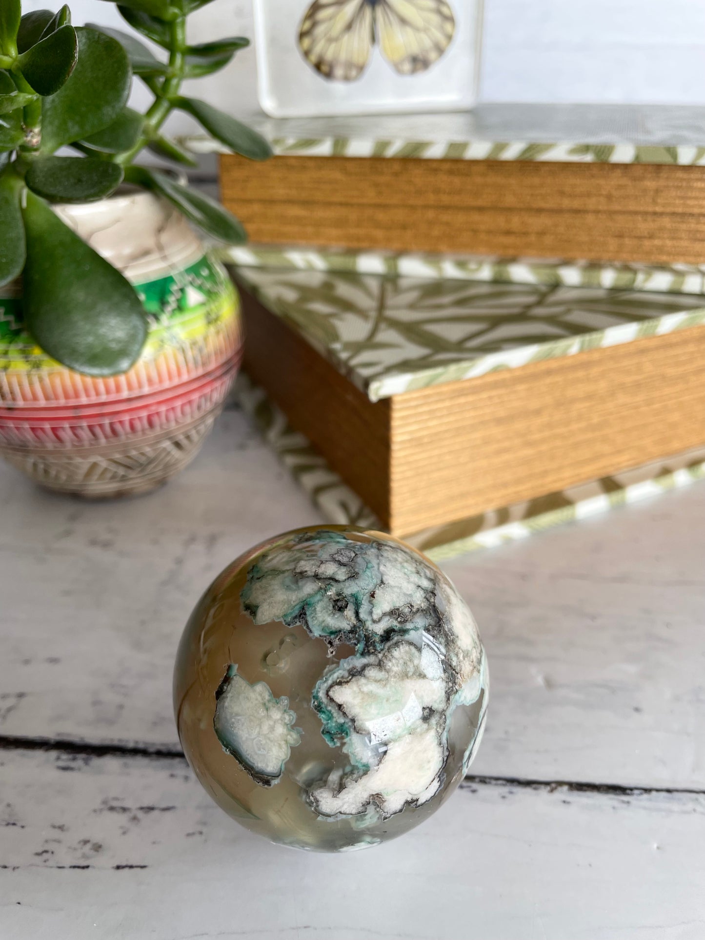 Green Flower Agate Sphere includes wooden holder