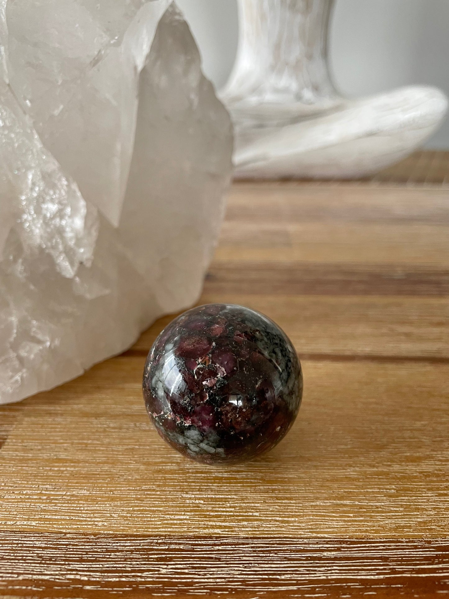 Eudialyte Sphere includes wooden holder