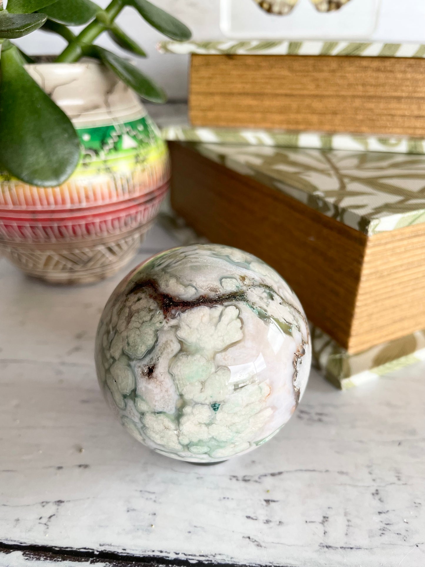 Green Flower Agate Sphere includes wooden holder