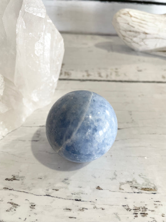 Blue Calcite Sphere Includes Wooden Holder