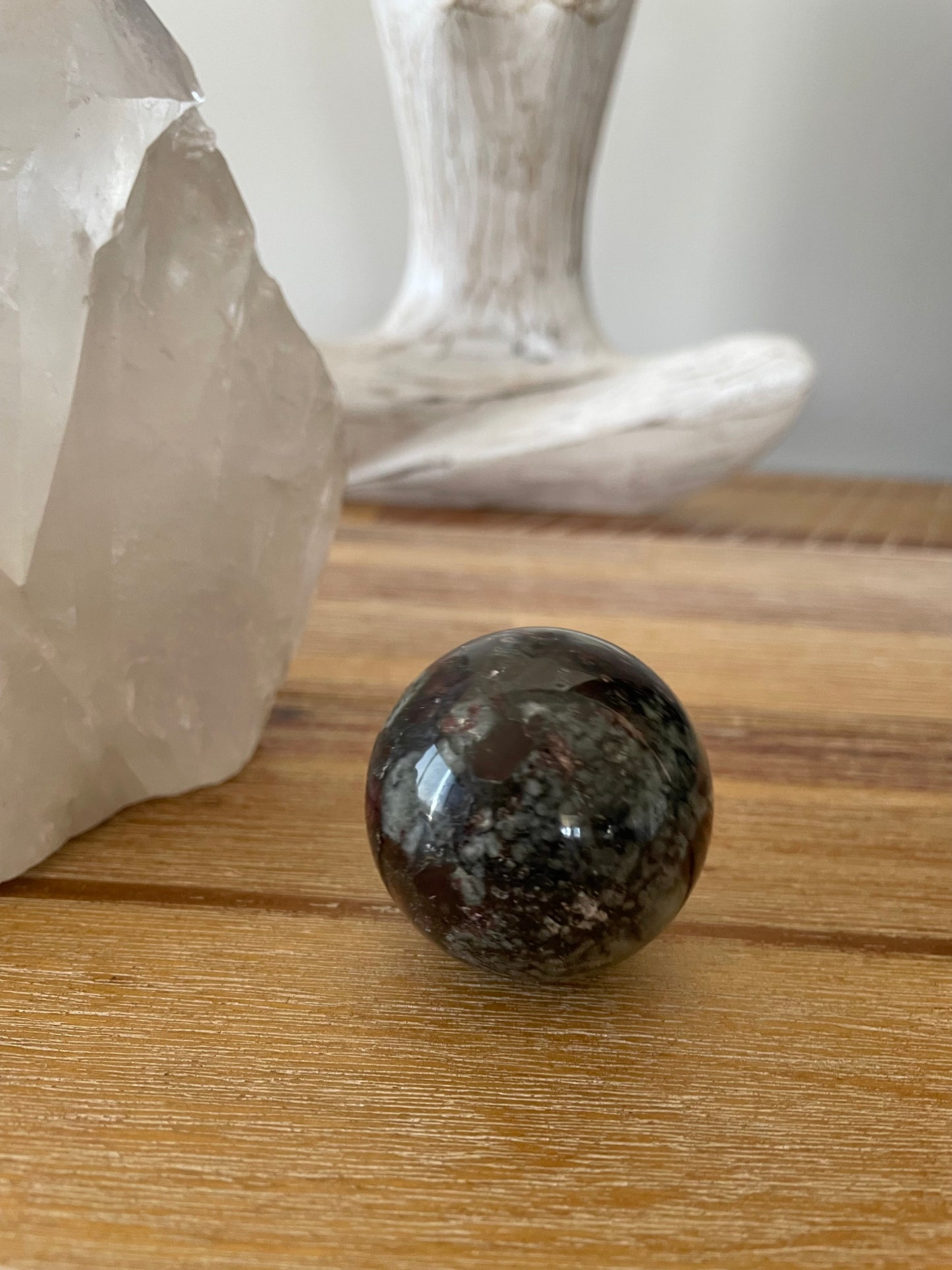 Eudialyte Sphere includes wooden holder