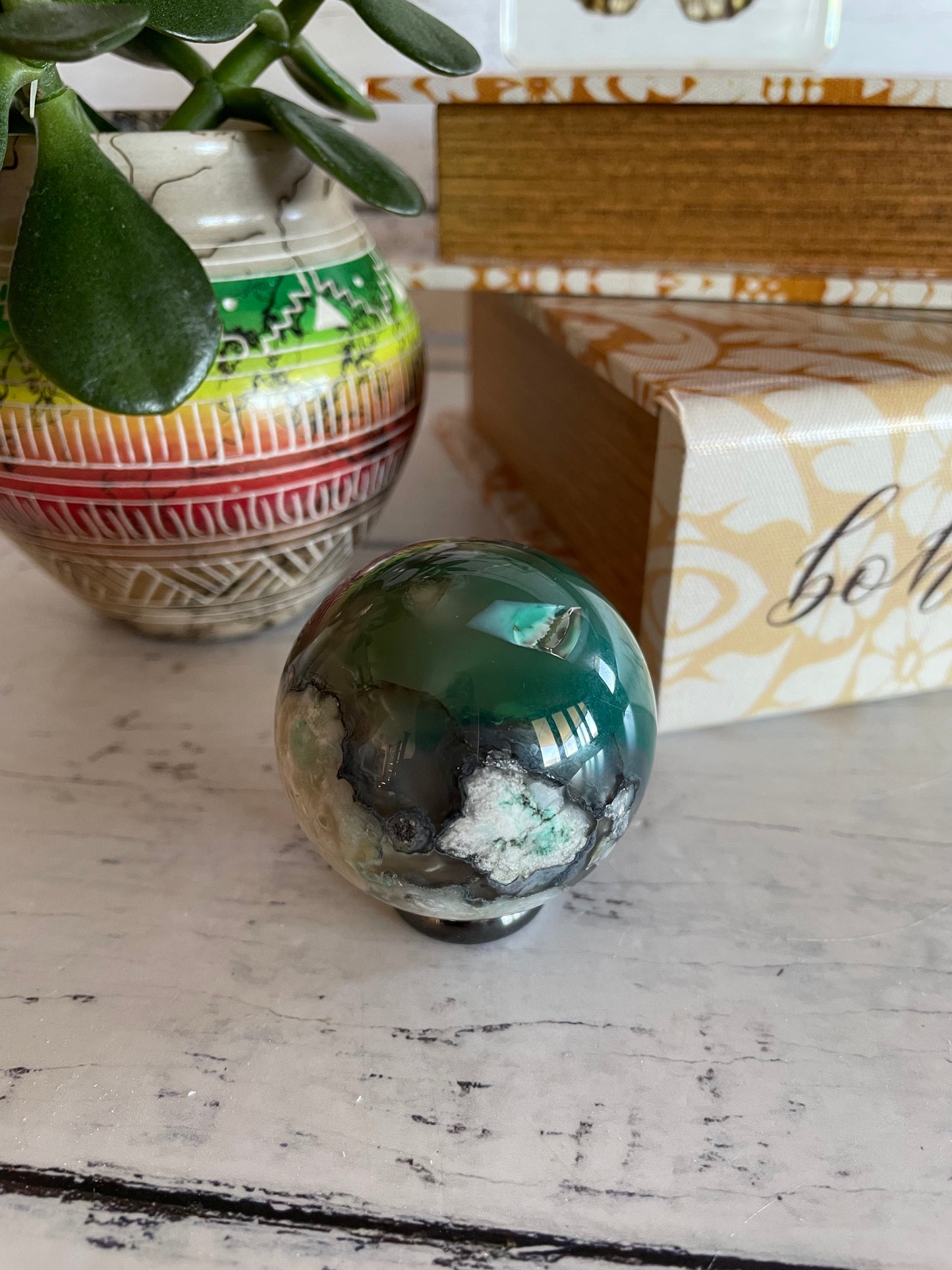 Green Flower Agate Sphere includes wooden holder