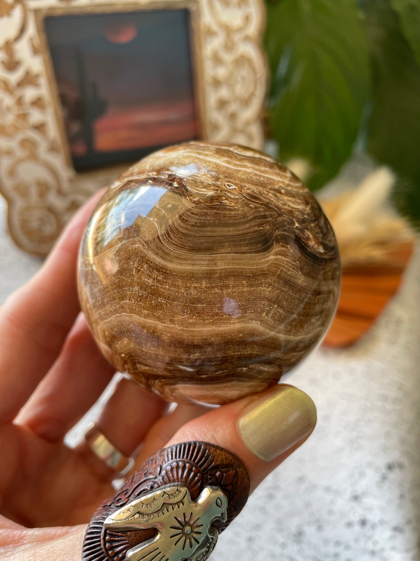 Chocolate Calcite Sphere Includes Wooden Holder