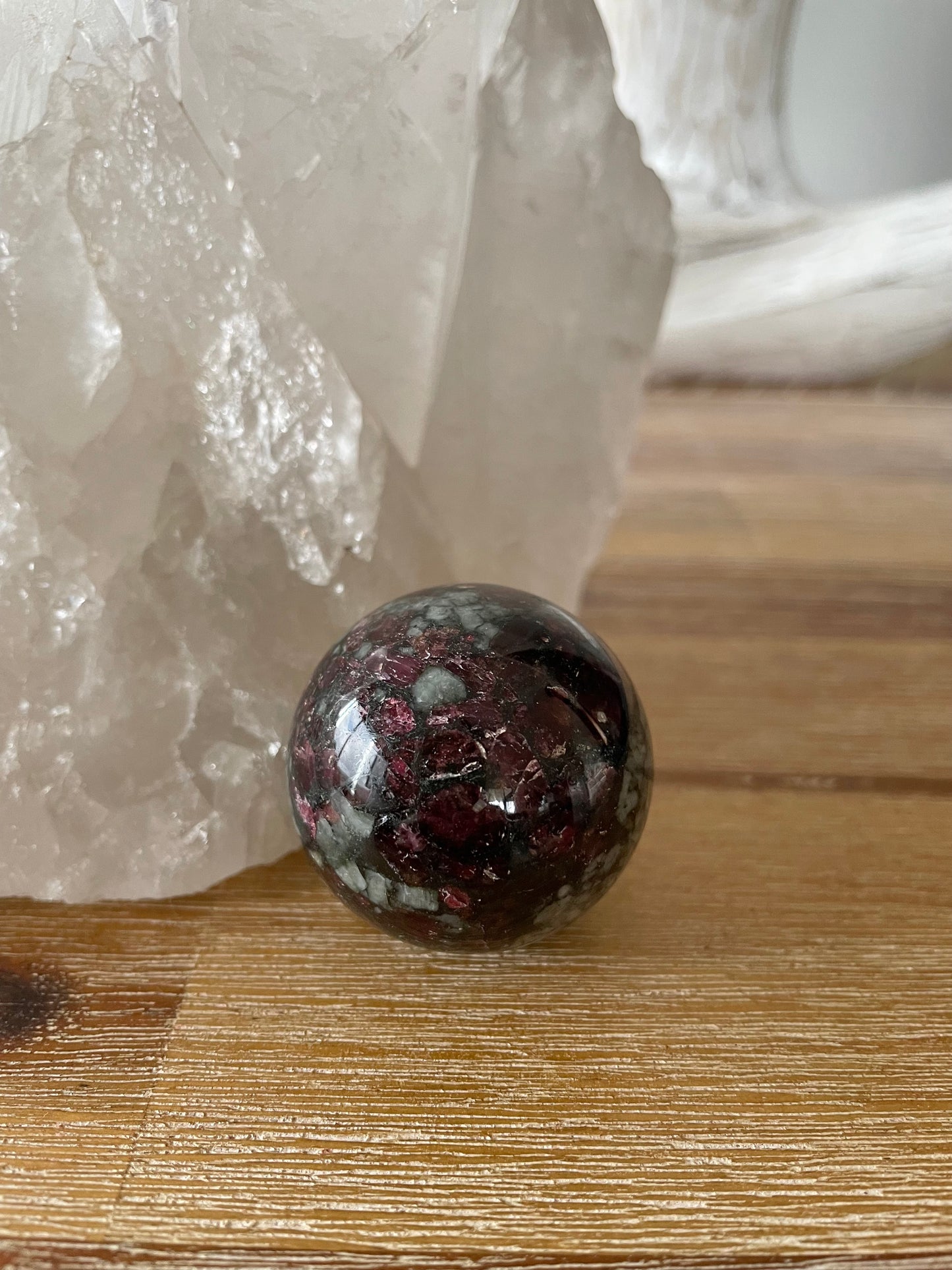 Eudialyte Sphere includes wooden holder