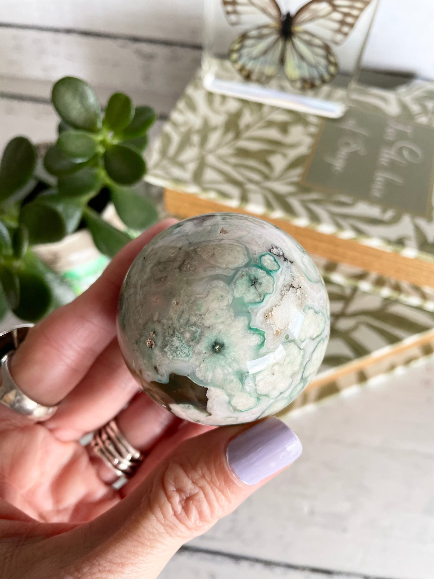 Green Flower Agate Sphere includes wooden holder