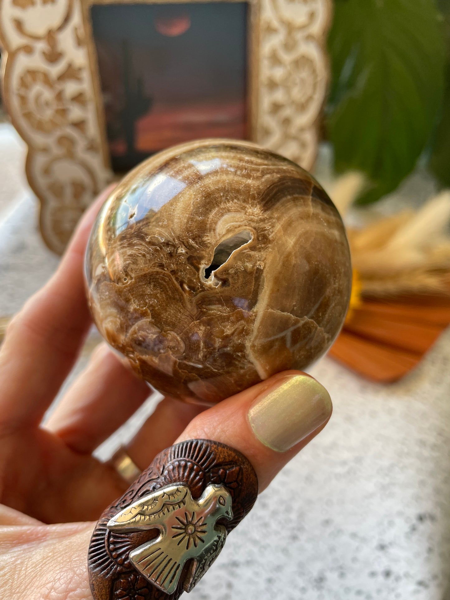 Chocolate Calcite Sphere Includes Wooden Holder