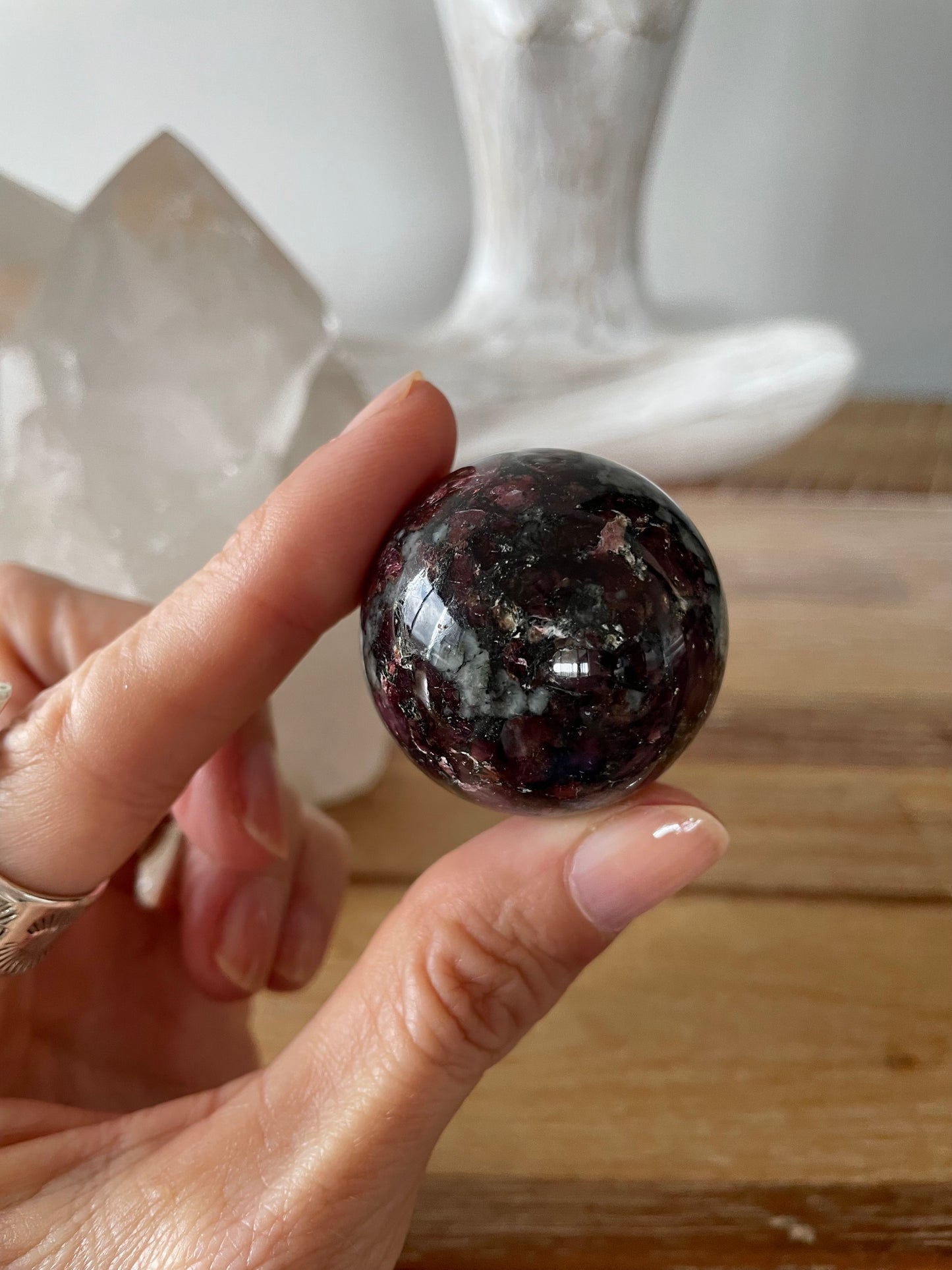 Eudialyte Sphere includes wooden holder