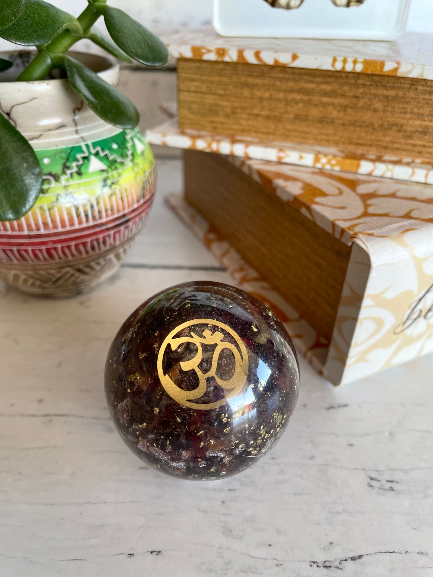 Orgone Sphere - Garnet Includes Wooden Holder