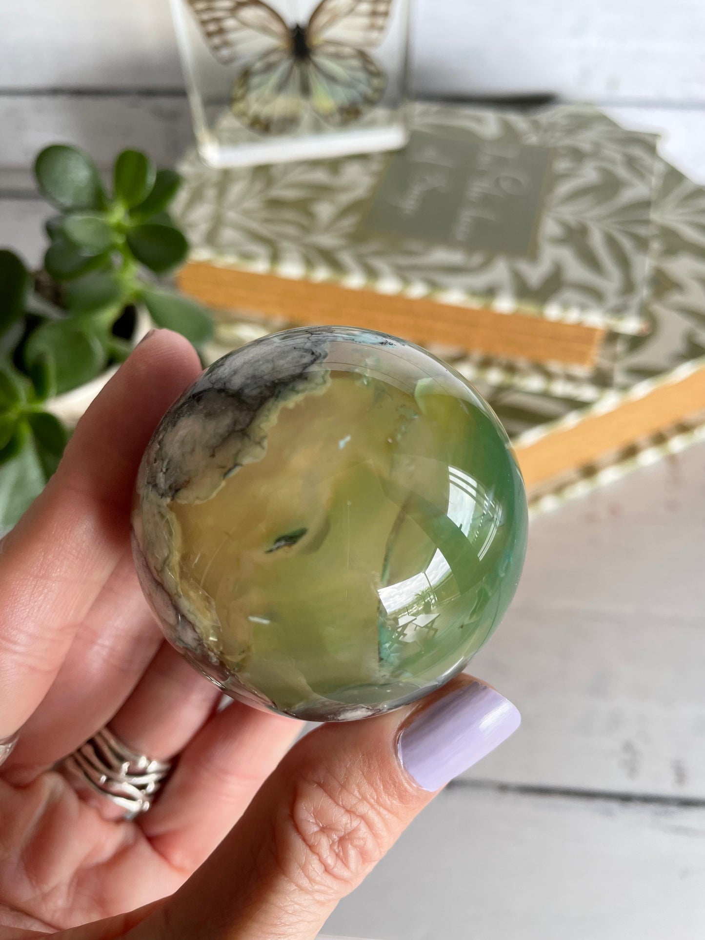 Green Flower Agate Sphere includes wooden holder