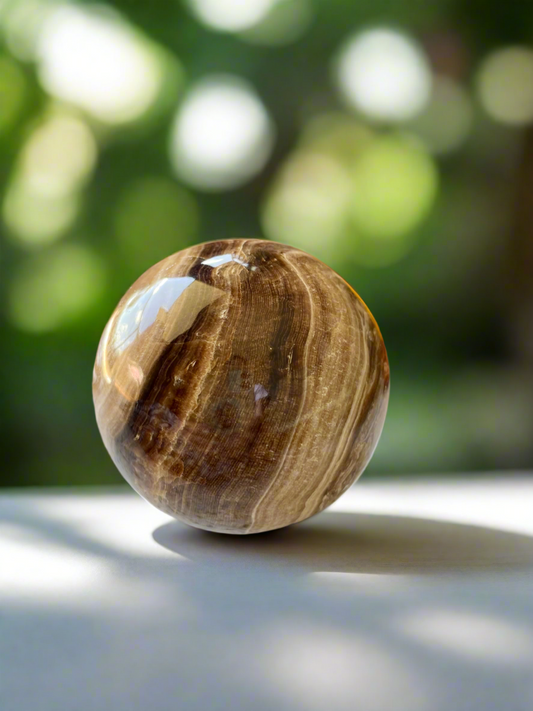 Chocolate Calcite Sphere includes holder