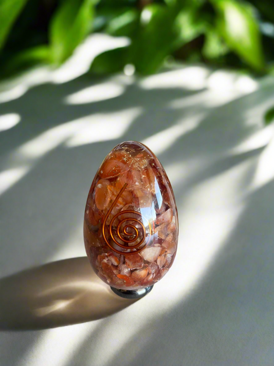 Carnelian copper egg includes holder