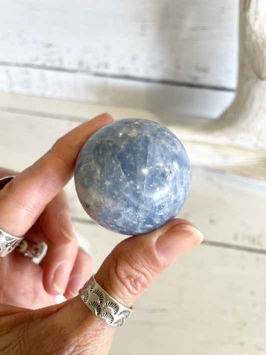 Blue Calcite Sphere Includes Wooden Holder