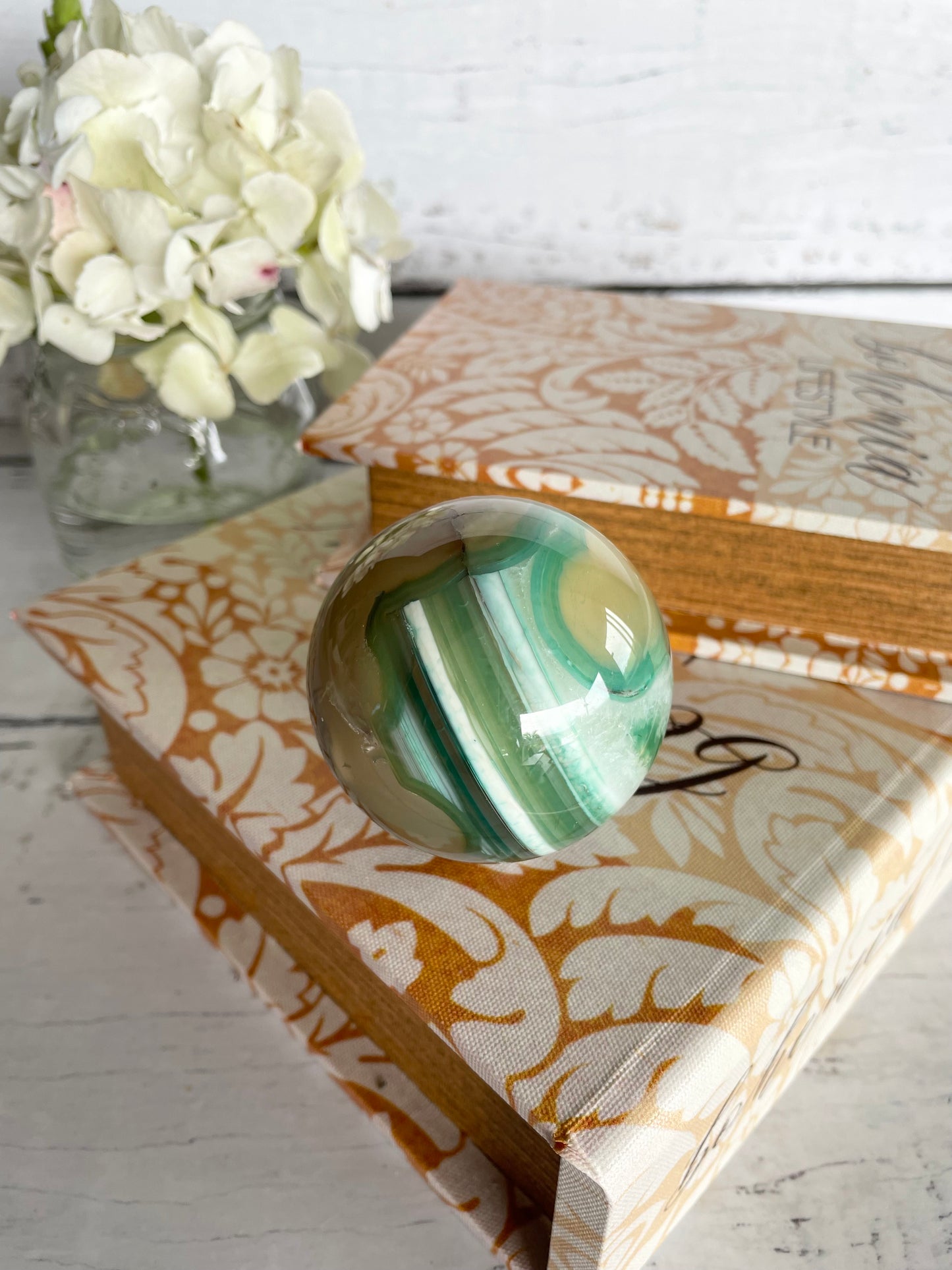 Green Flower Agate Sphere includes wooden holder