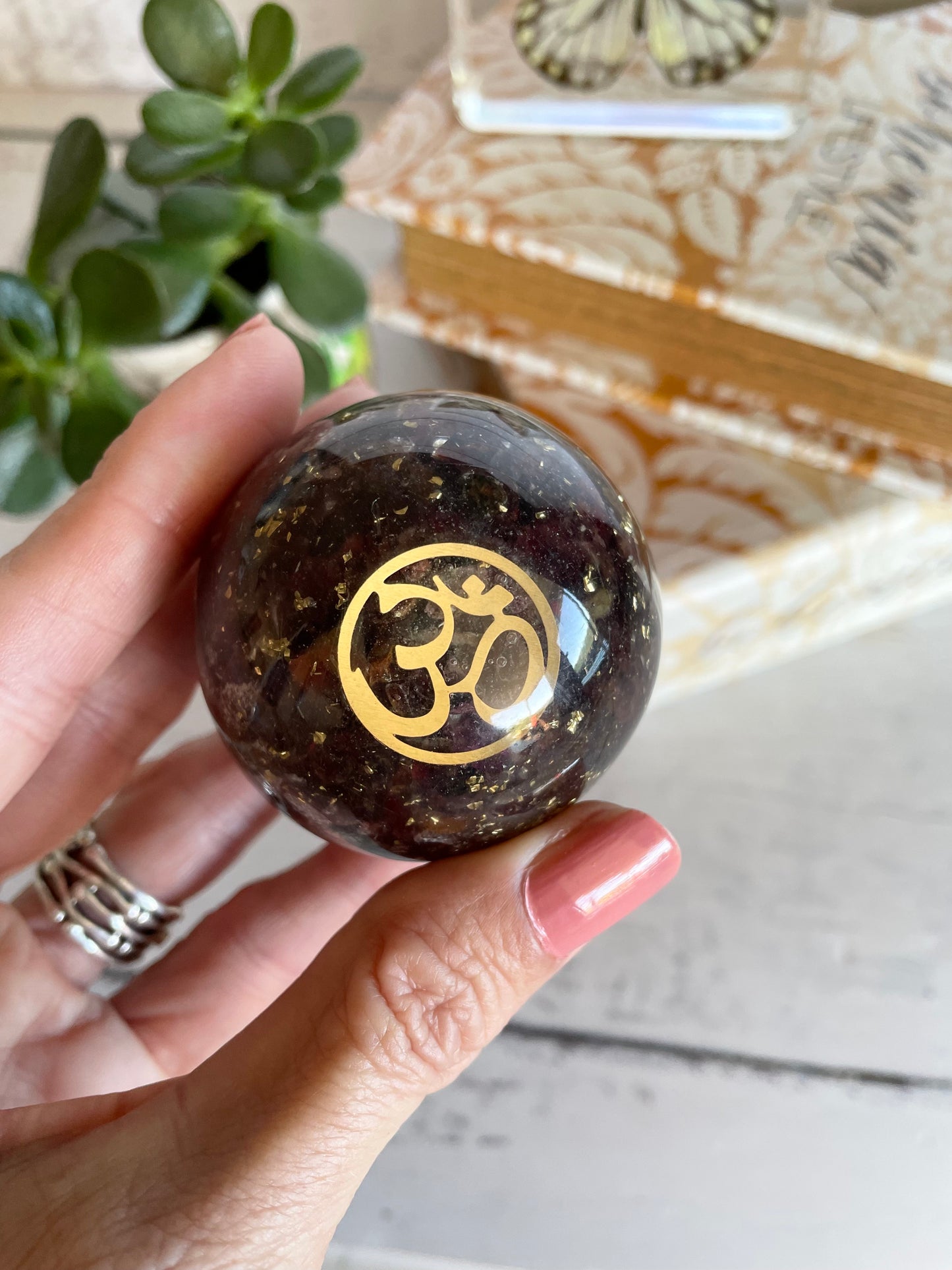 Orgone Sphere - Garnet Includes Wooden Holder