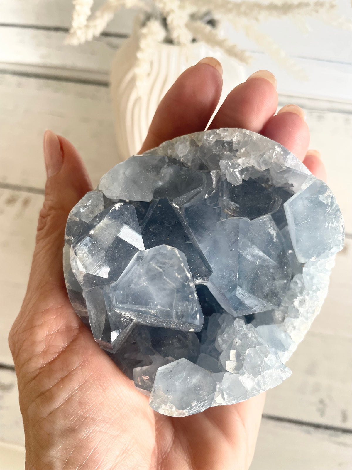 Celestite Geode Sphere includes hematite holder