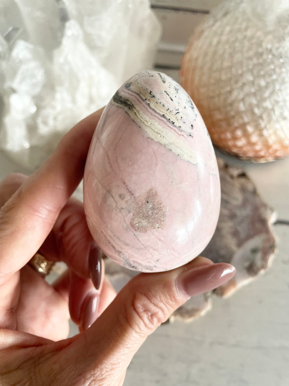Rhodochrosite Egg includes holder