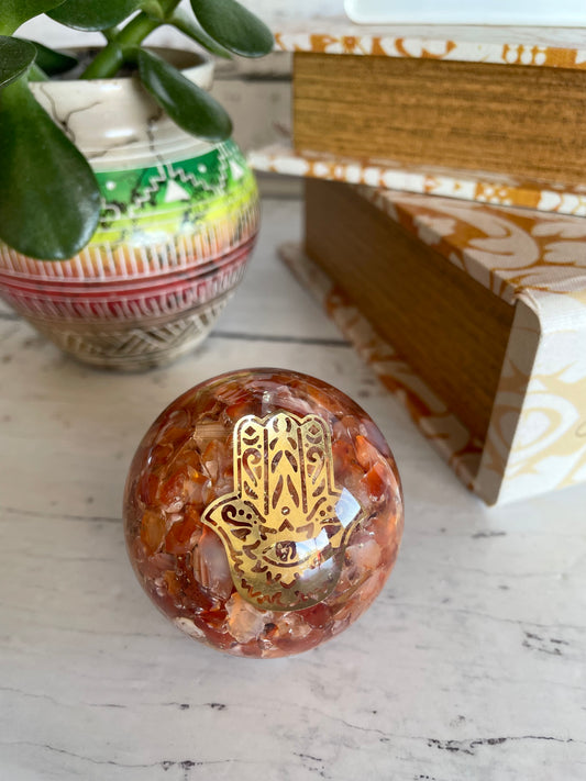 Orgone Sphere - Carnelian Includes Wooden holder