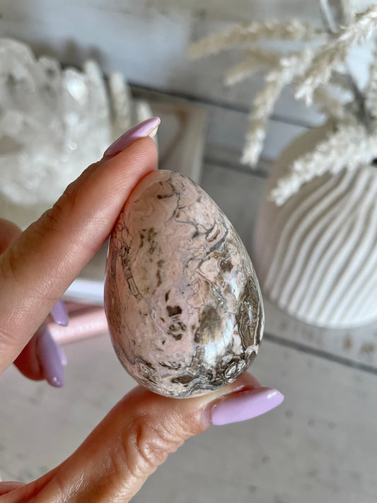 Rhodochrosite Egg with holder