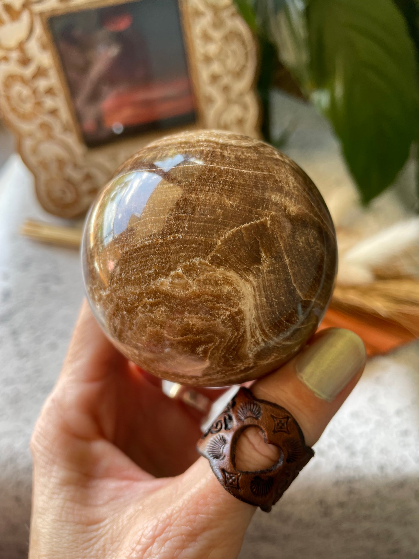 Chocolate Calcite Sphere Includes Wooden Holder