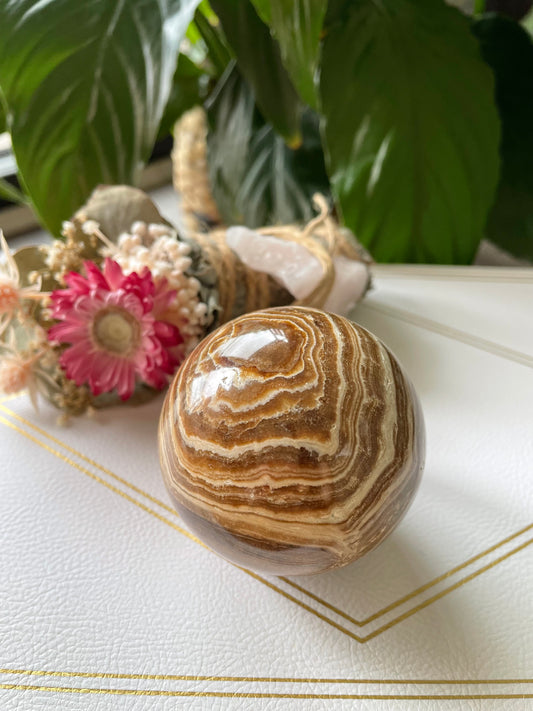 Chocolate Calcite Sphere Includes Wooden Holder